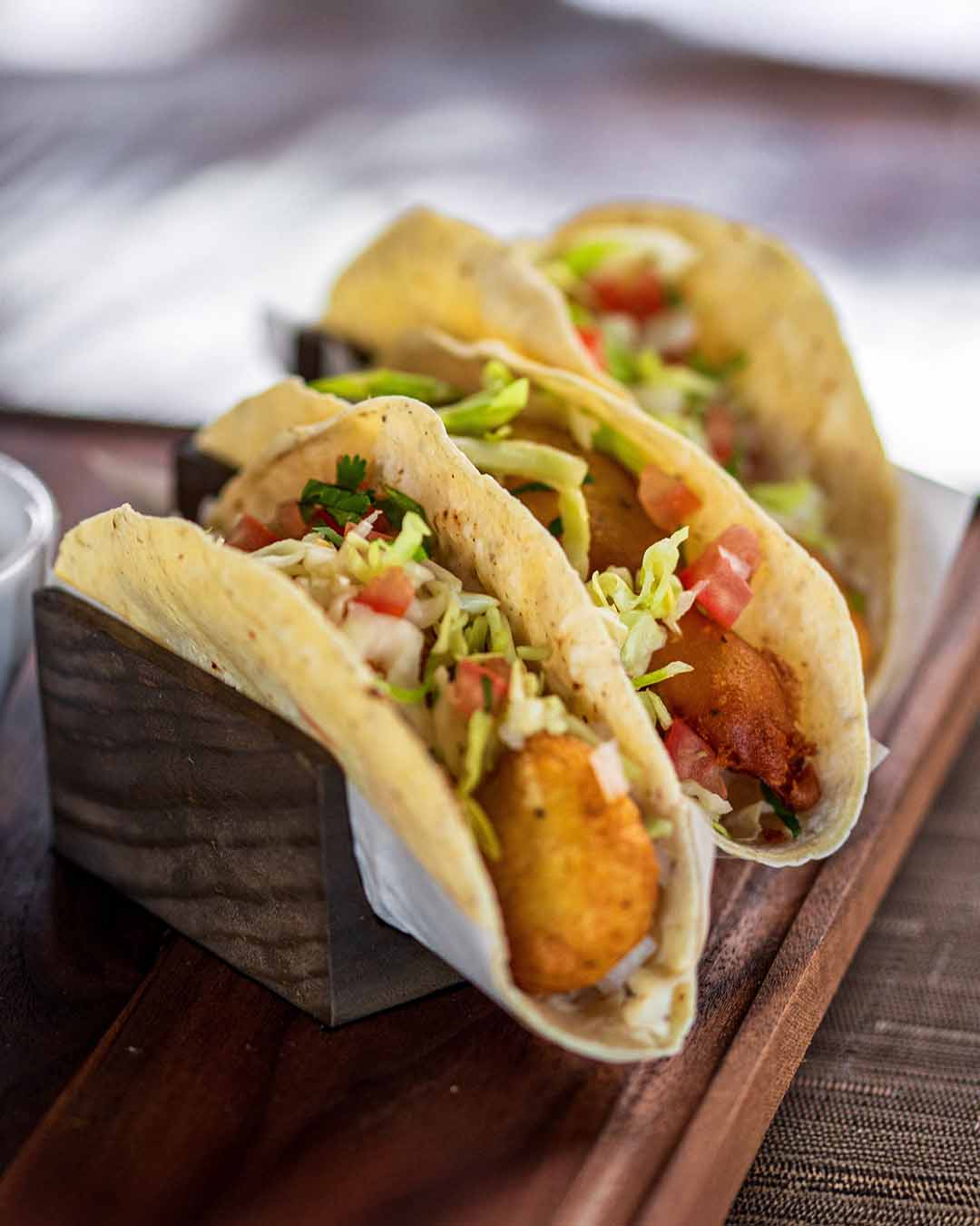 Three Baja-style tacos served at La Troja Restaurant